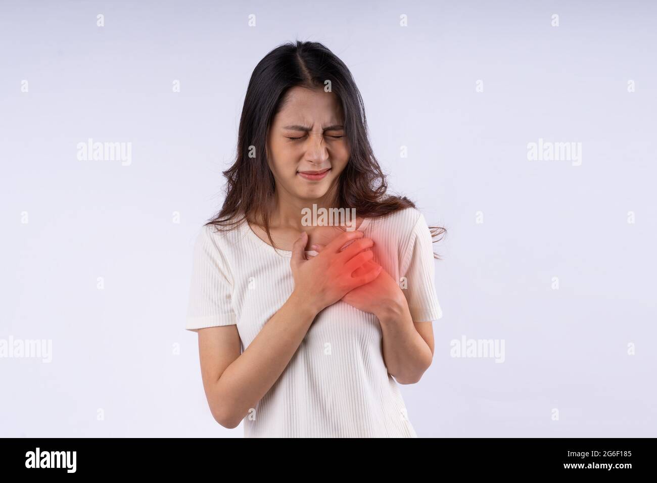 portrait of asian woman having heart attack, isolated on white background Stock Photo