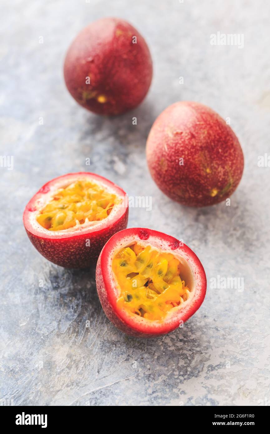 Organic raw passion fruit on kitchen table. Stock Photo
