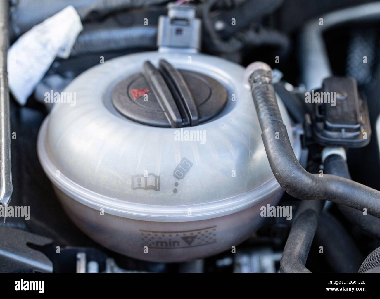 expansion tank with car coolant, closeup Stock Photo Alamy