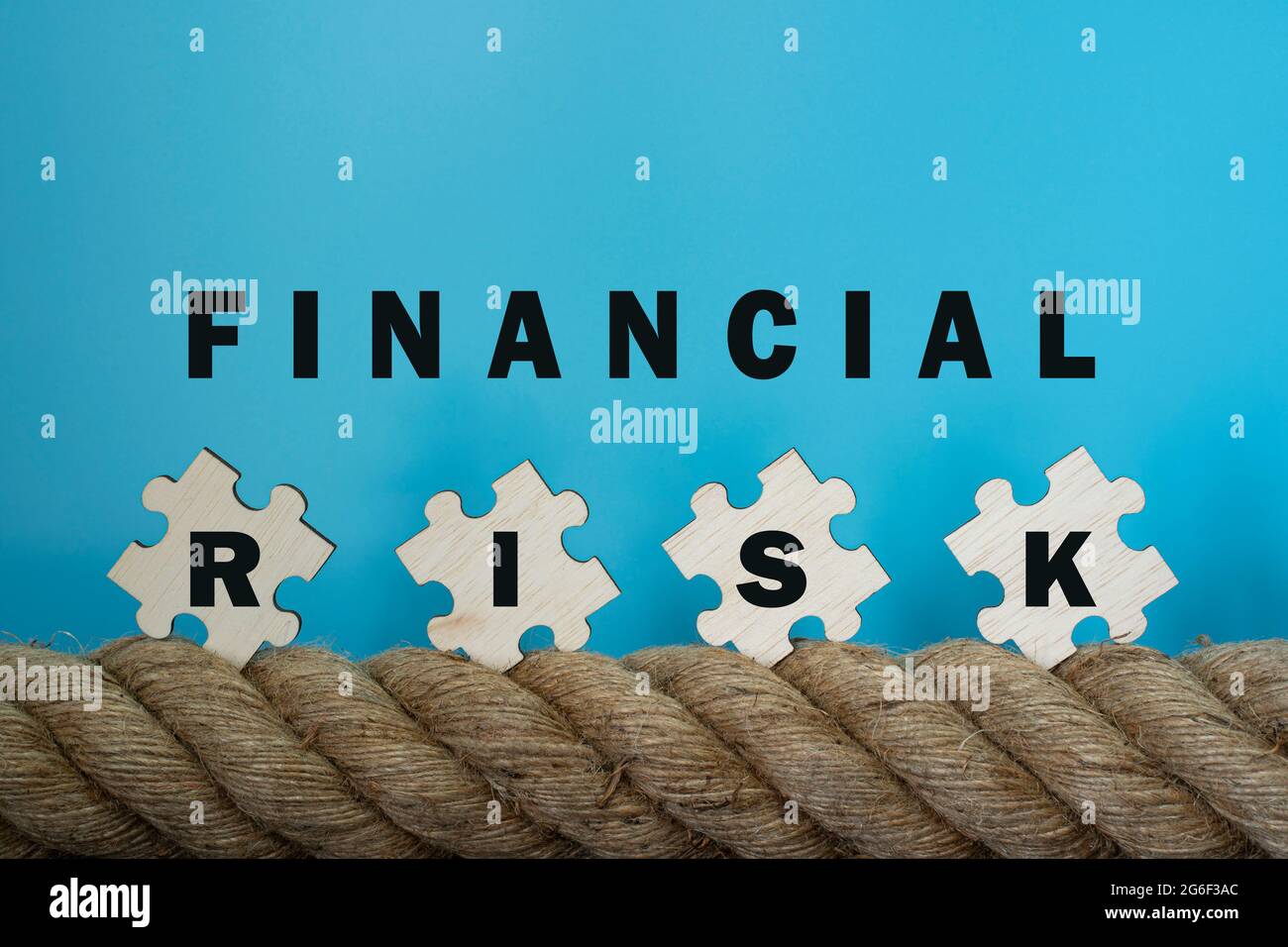 Financial concept. Rope and jigsaw tiles with text. Selective focus points. Stock Photo