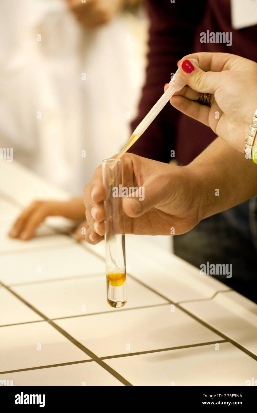 Close view of a chemistry student making an experiment. Stock Photo