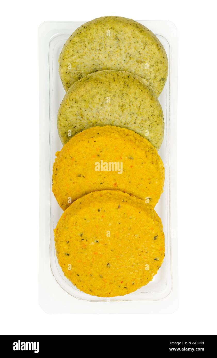 Vegetable patties in a plastic container. Ready to fry vegan patties, made of butternut pumpkin or broccoli, on a soy and wheat protein base. Stock Photo