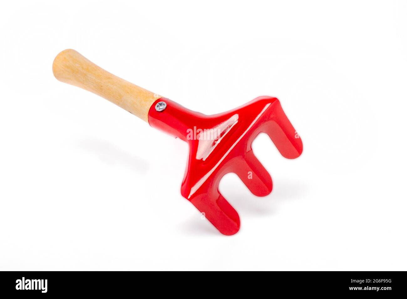 Close up view of a small gardening fork isolated on a white background