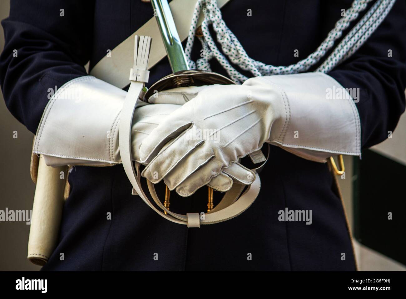 Close up view of a guarding police uniform hands with gloves Stock