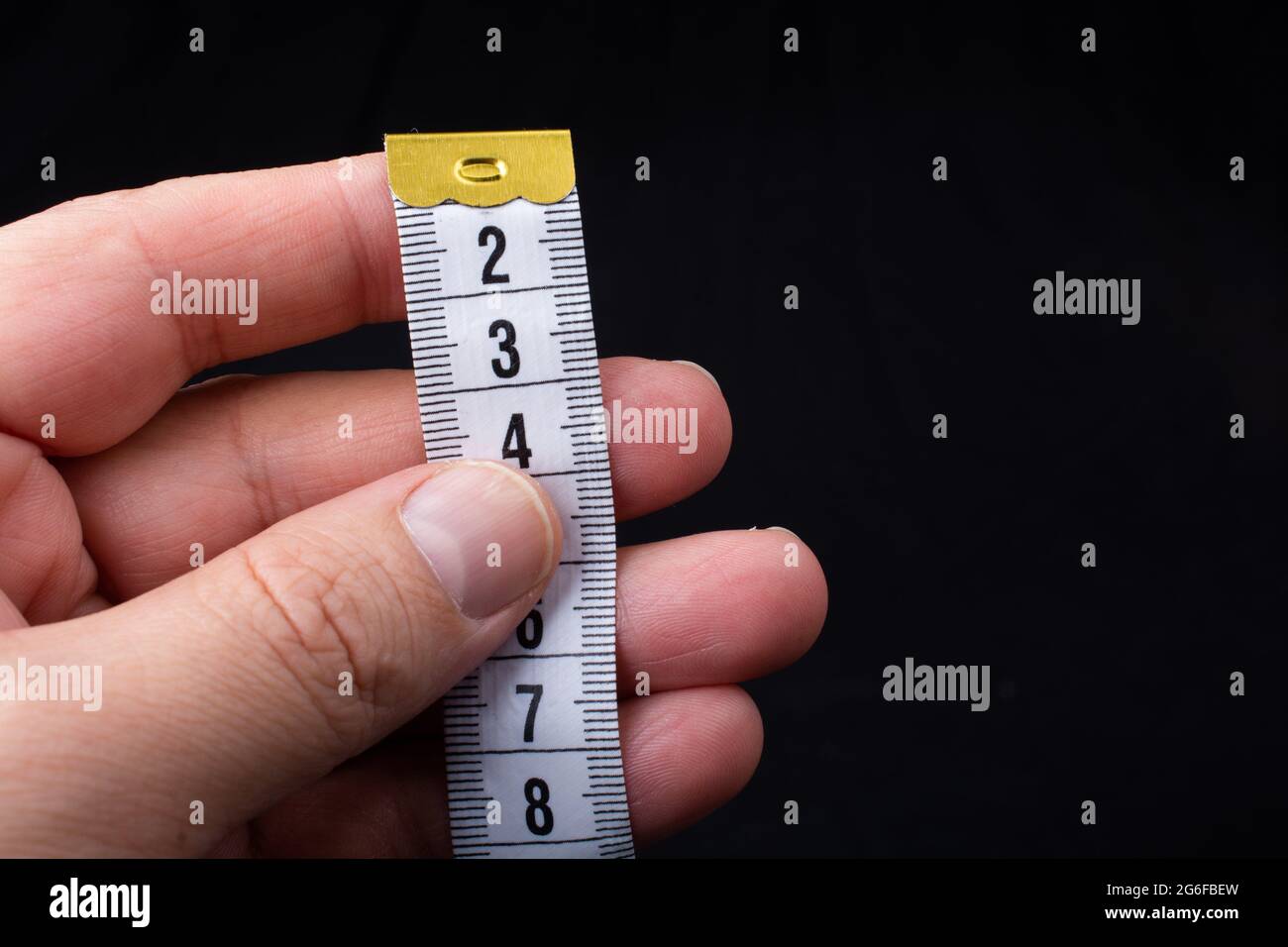 soft measuring tape. tape measure with metric scale. Stock Photo