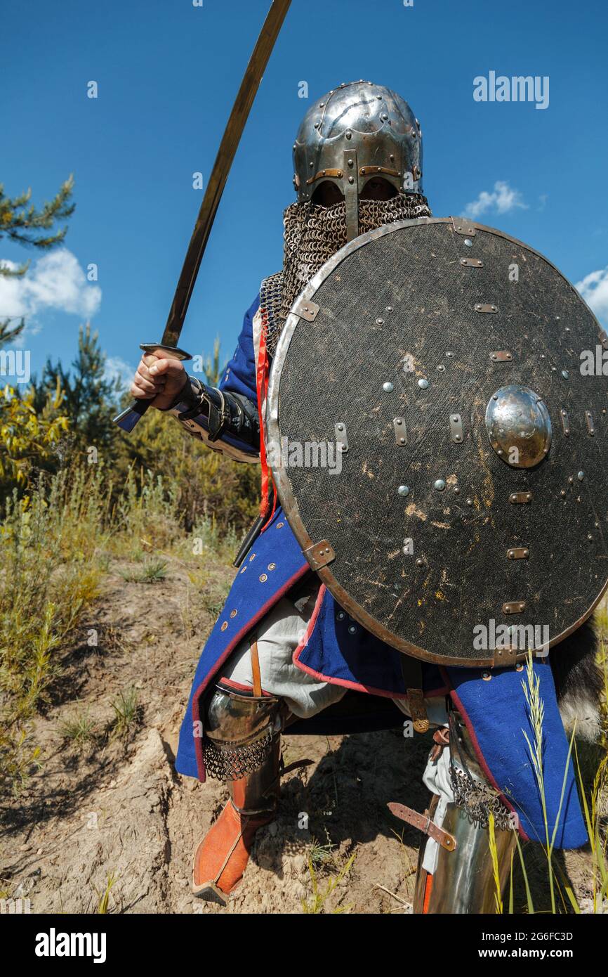 Mongol horde warrior in armour holding traditional saber. Stock Photo