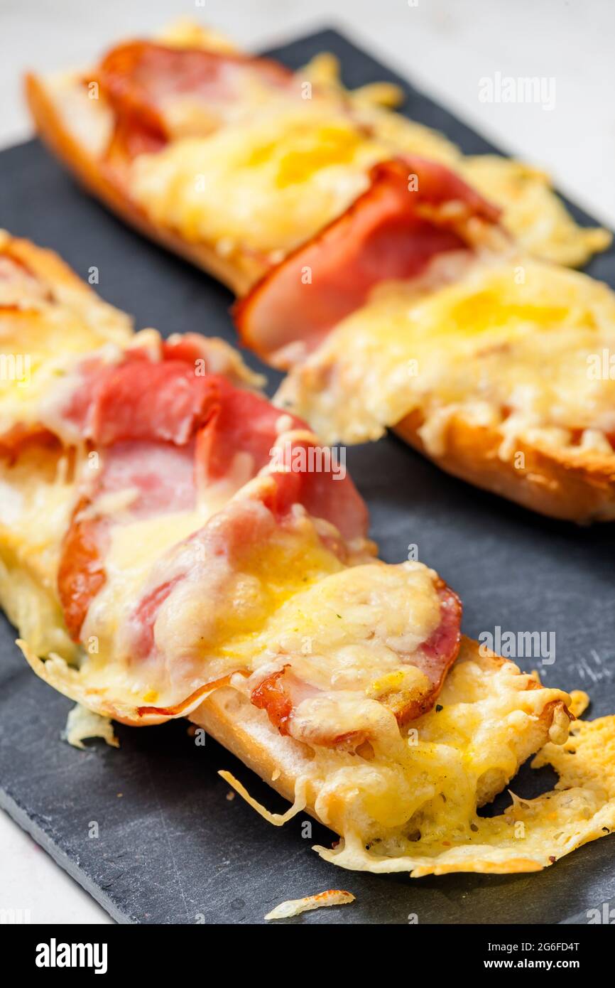 baguette baked with ham and cheese Stock Photo Alamy