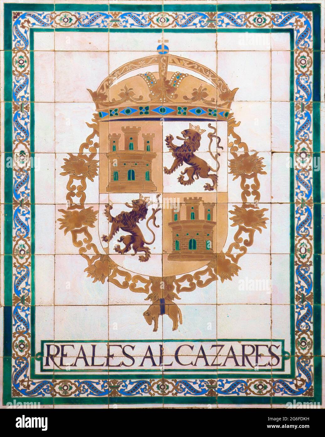 Royal Alcazars of Seville. Coat of arms glazed tiled. Stock Photo