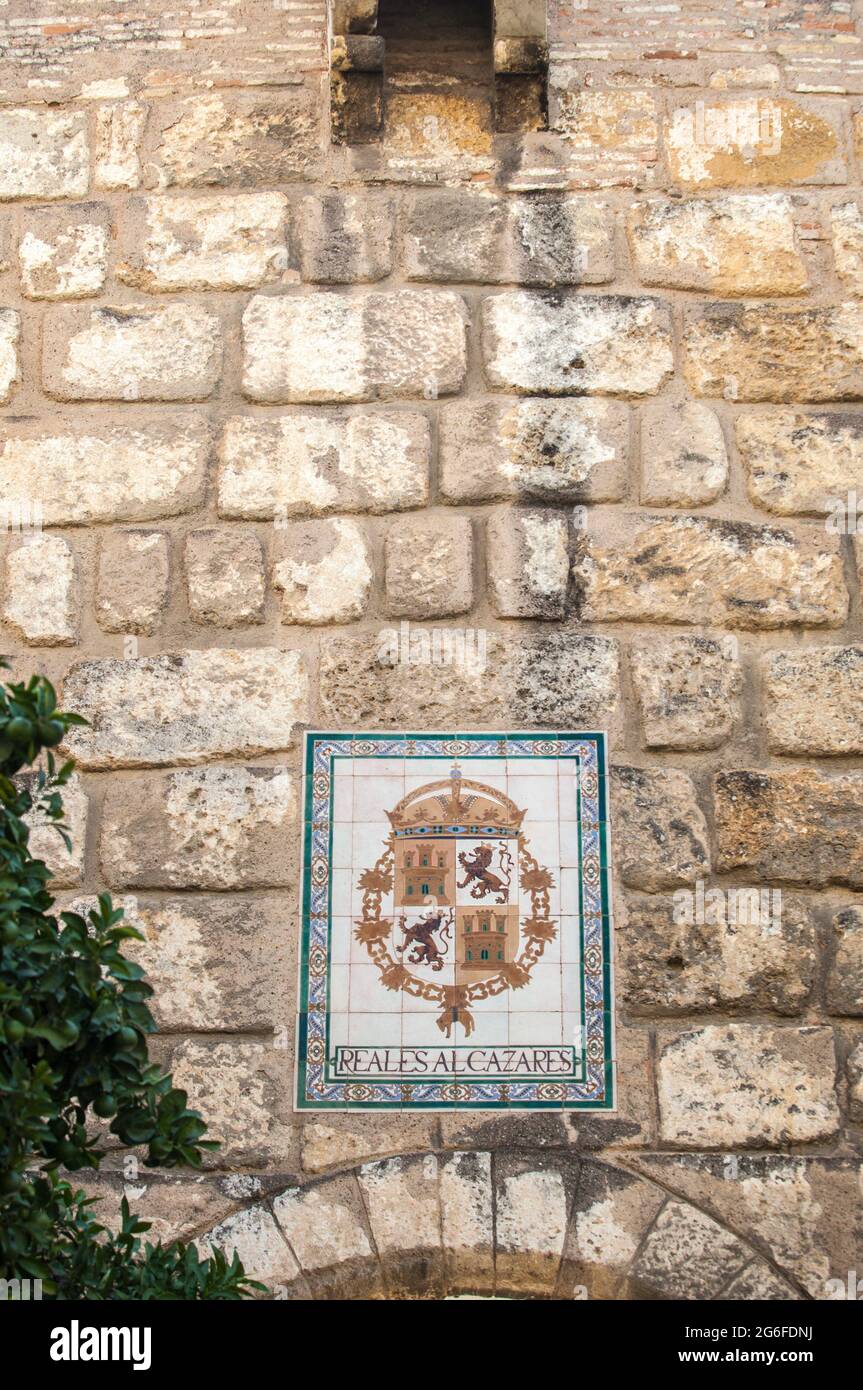 Royal Alcazars of Seville. Coat of arms glazed tiled. Stock Photo
