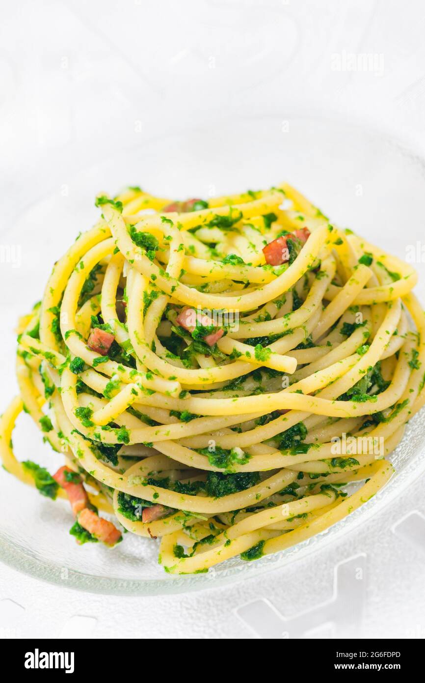 spaghetti with bacon and parsley Stock Photo Alamy