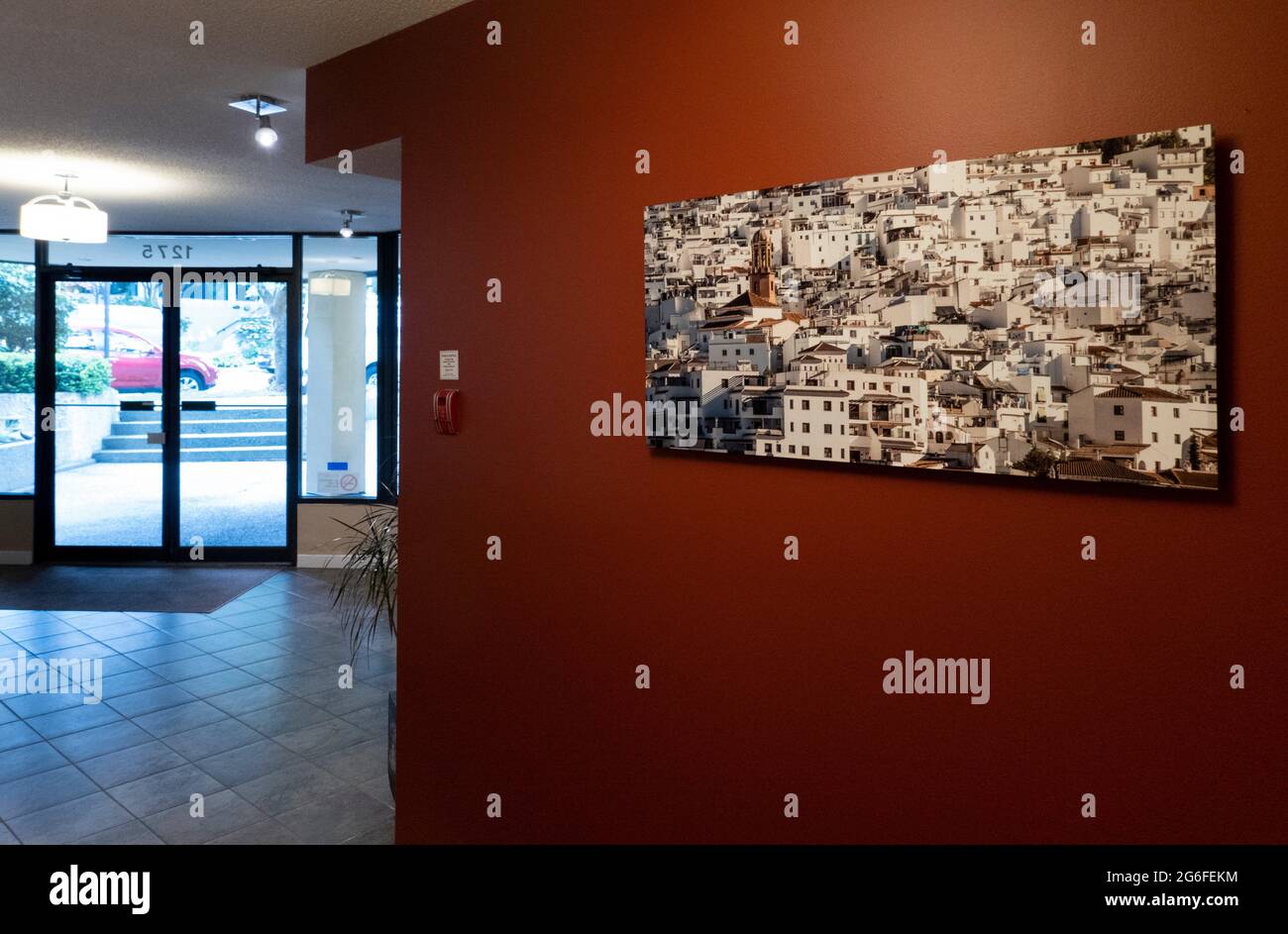 A photograph of a Spanish white village on the wall in the lobby of a Vancouver apartment