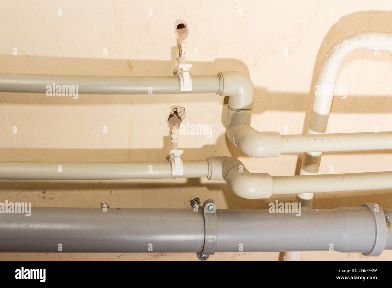 Plastic domestic plumbing pipes connections in need of fixing repair