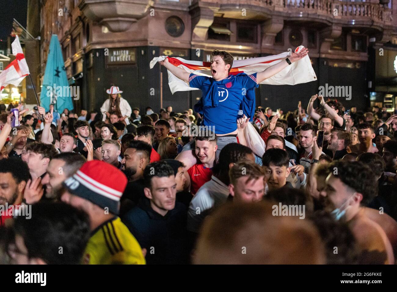 English football fans celebrate in Leicester Square after the Euro 2020 England versus Ukraine match, London, 3 July 2021 Stock Photo