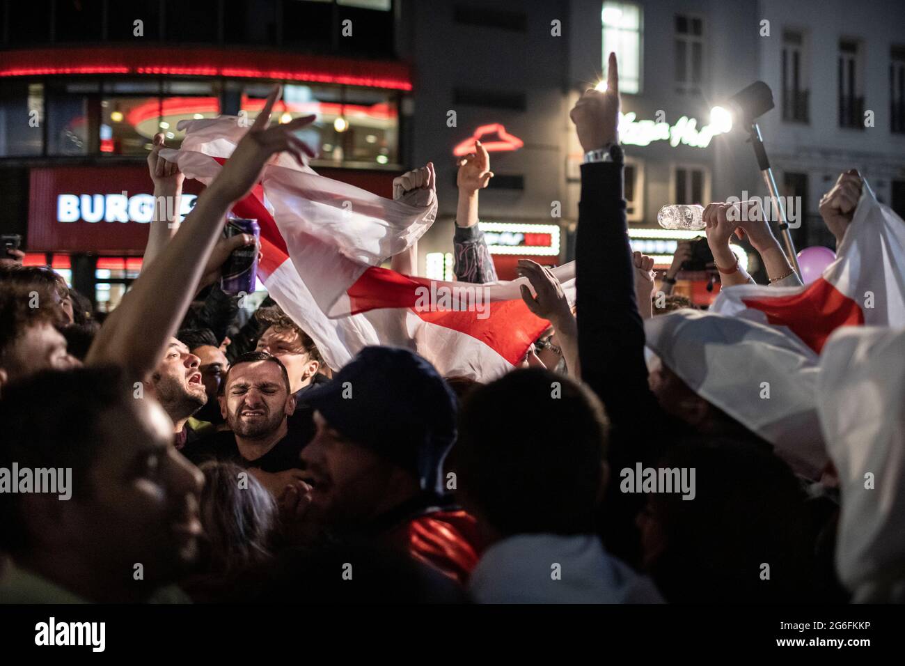 English football fans celebrate in Leicester Square after the Euro 2020 England versus Ukraine match, London, 3 July 2021 Stock Photo