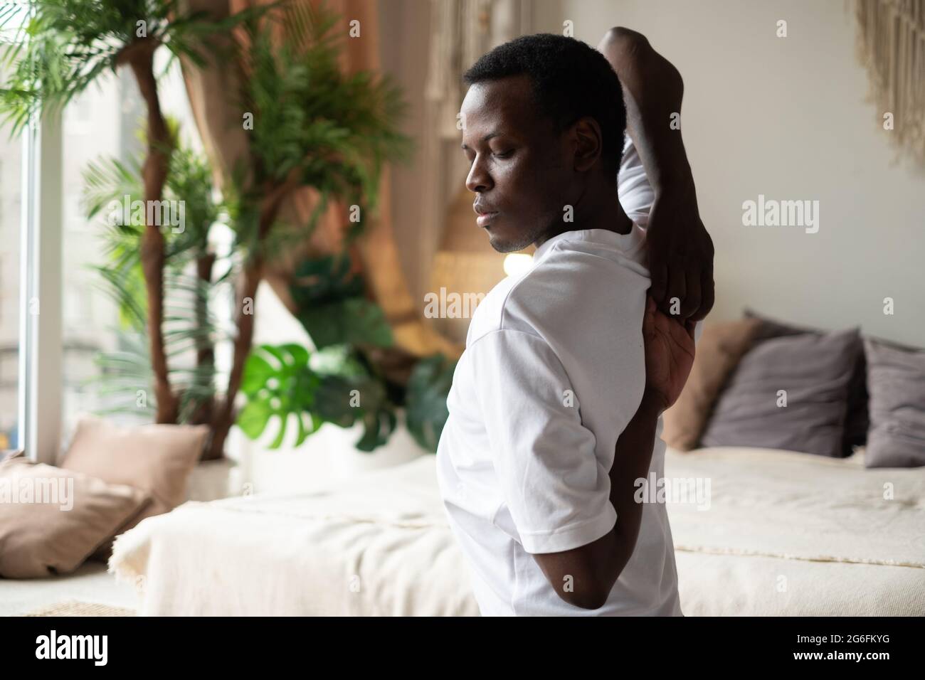 Young african man stretching neck hi-res stock photography and images ...