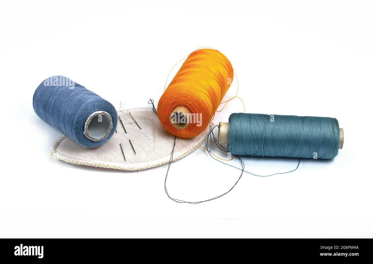 Color sewing threads isolated on white background Stock Photo - Alamy