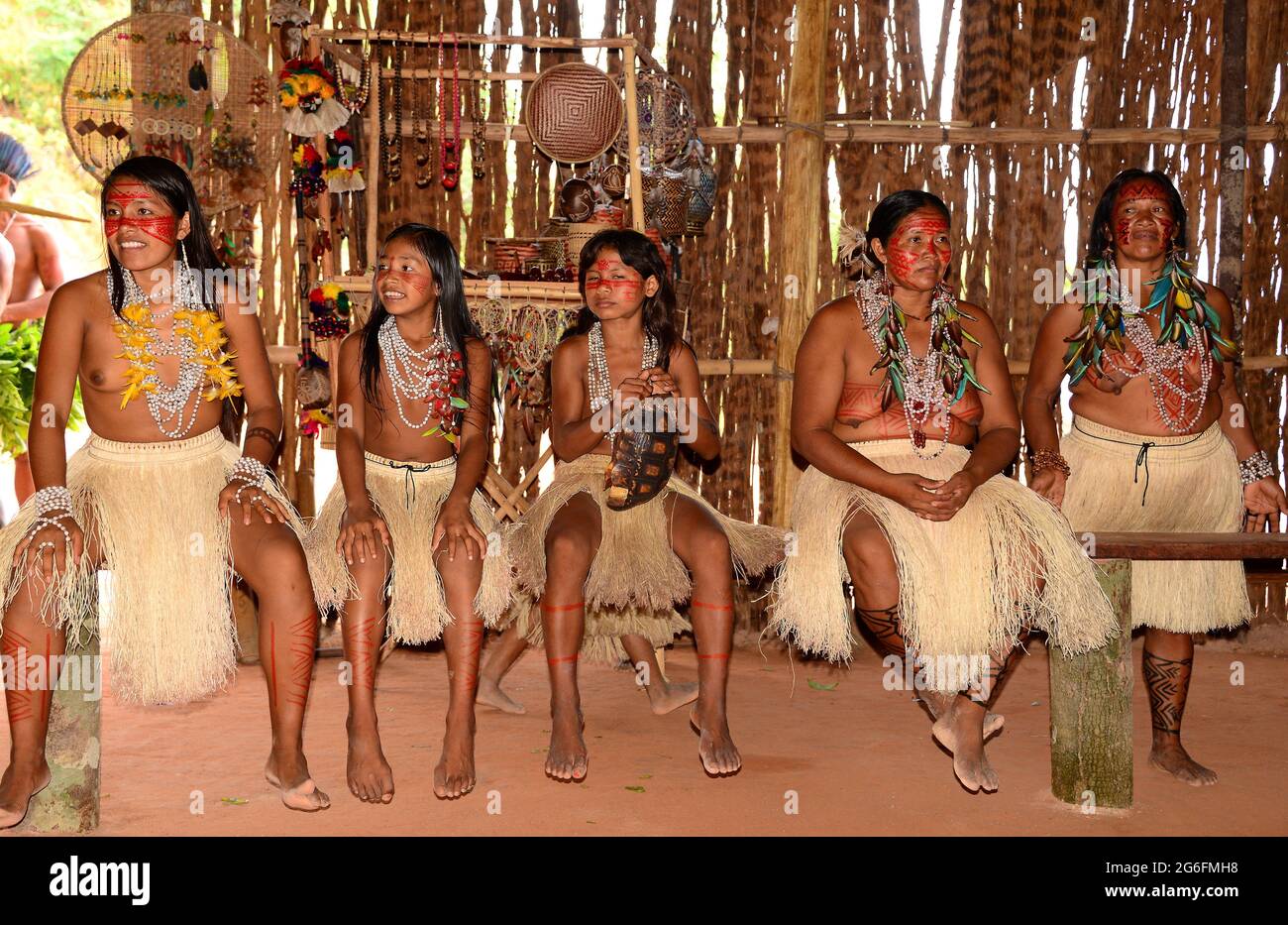 Tatuyo village near Manaus. Girls and women inside hut. Brazil. Stock Photo