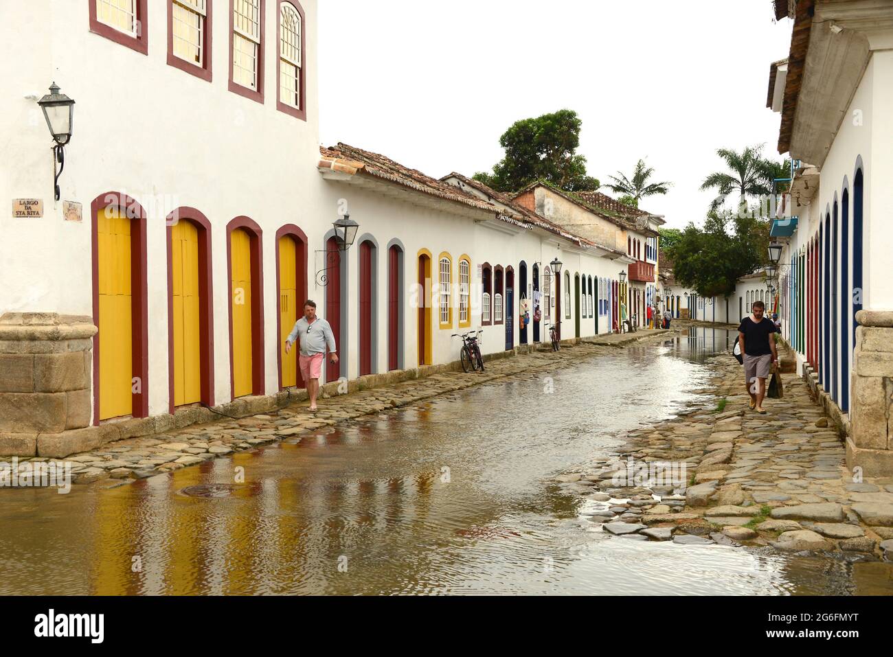 Paraty with flooded streets by high tide (cleaning streets). Costa Verde, Brazil. Stock Photo