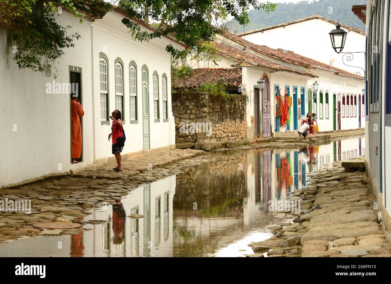 Paraty with flooded streets by high tide (cleaning streets). Costa Verde, Brazil. Stock Photo