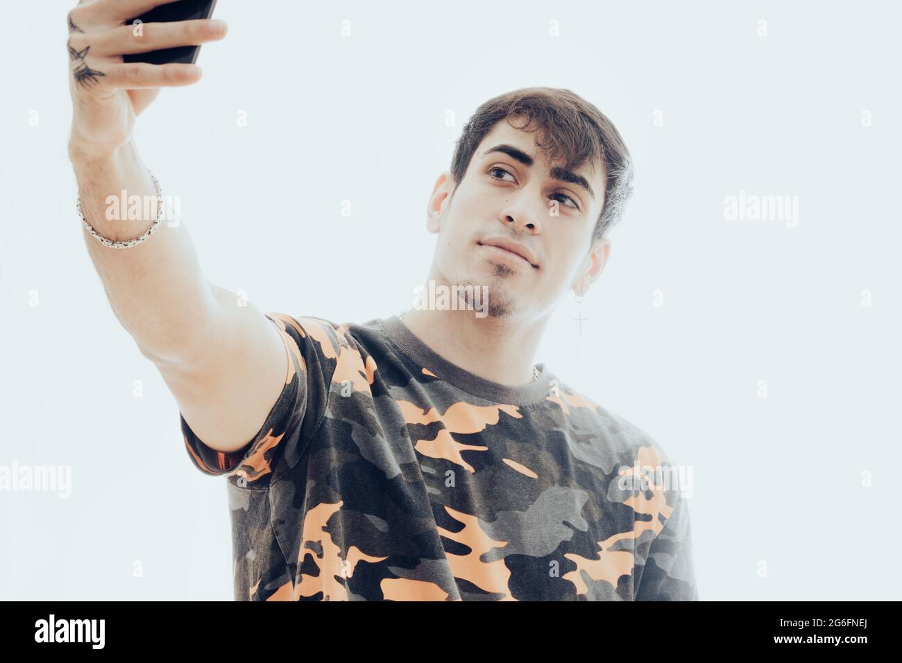 Young man making a selfie with the mobile phone Stock Photo