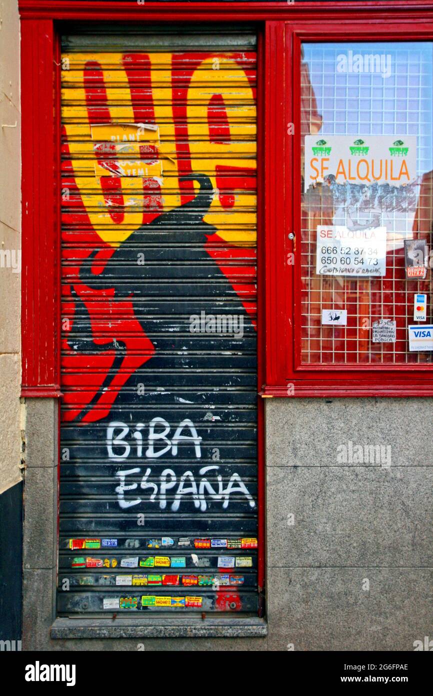 blind with graffiti of commercial premises for rent, Madrid, Spain