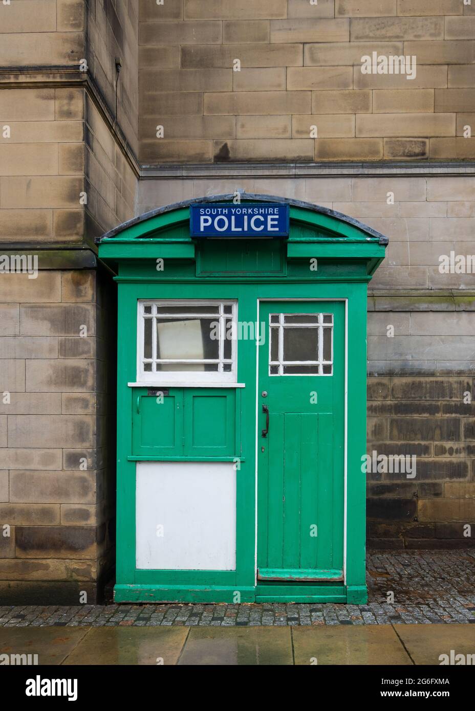 Vintage old disused green and white wooden police telephone box from 1929. Last remaining one in Sheffield South Yorkshire on Surrey Street. Original Stock Photo