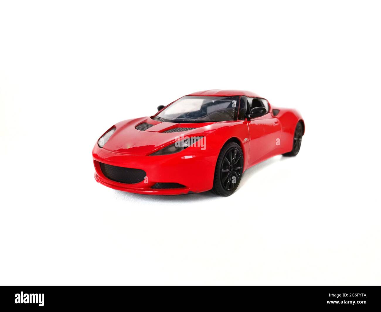 Red sports car.  Red sports toy car.  White background and car. Stock Photo