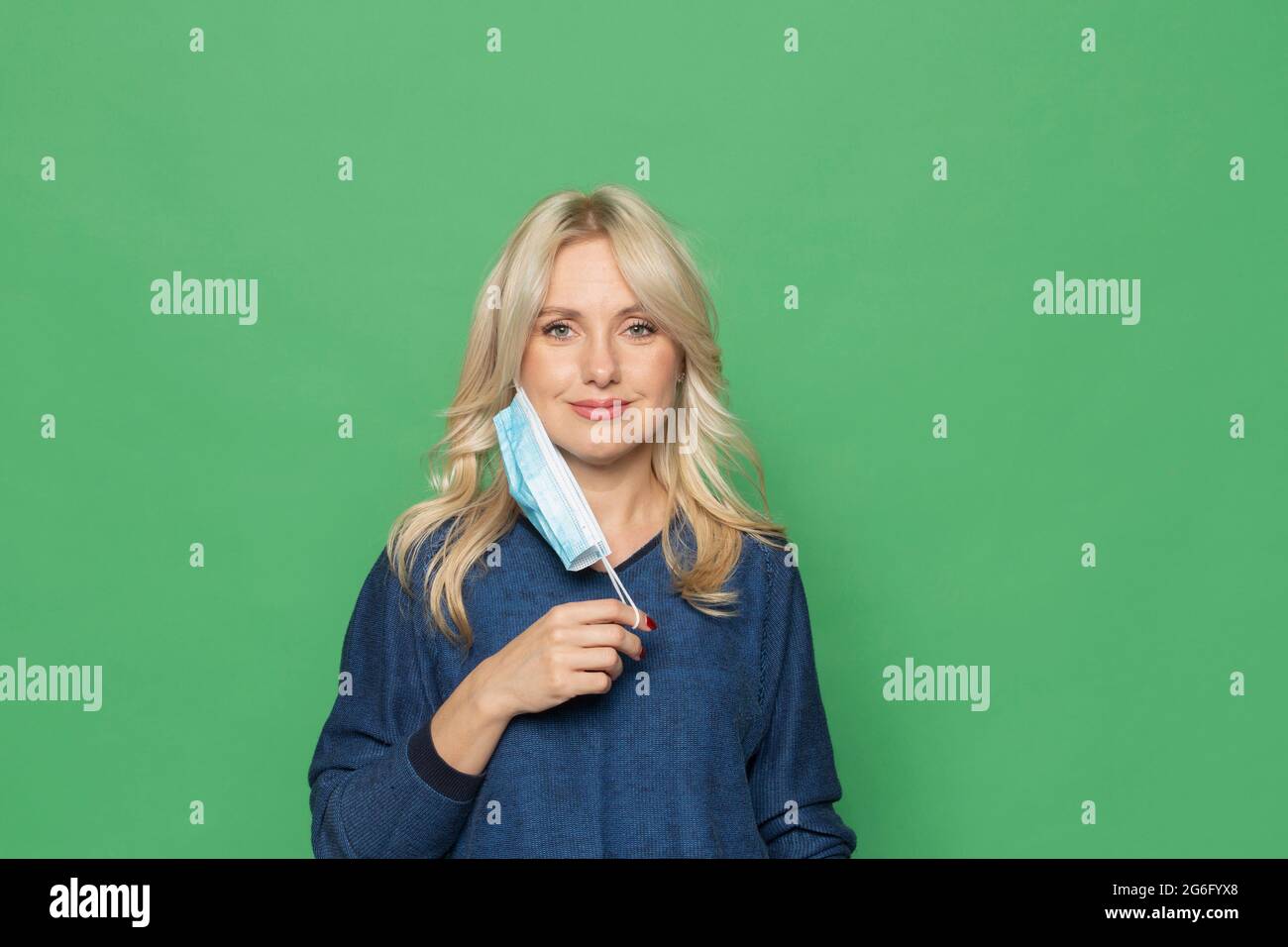Woman removing face mask covid hi-res stock photography and images - Alamy
