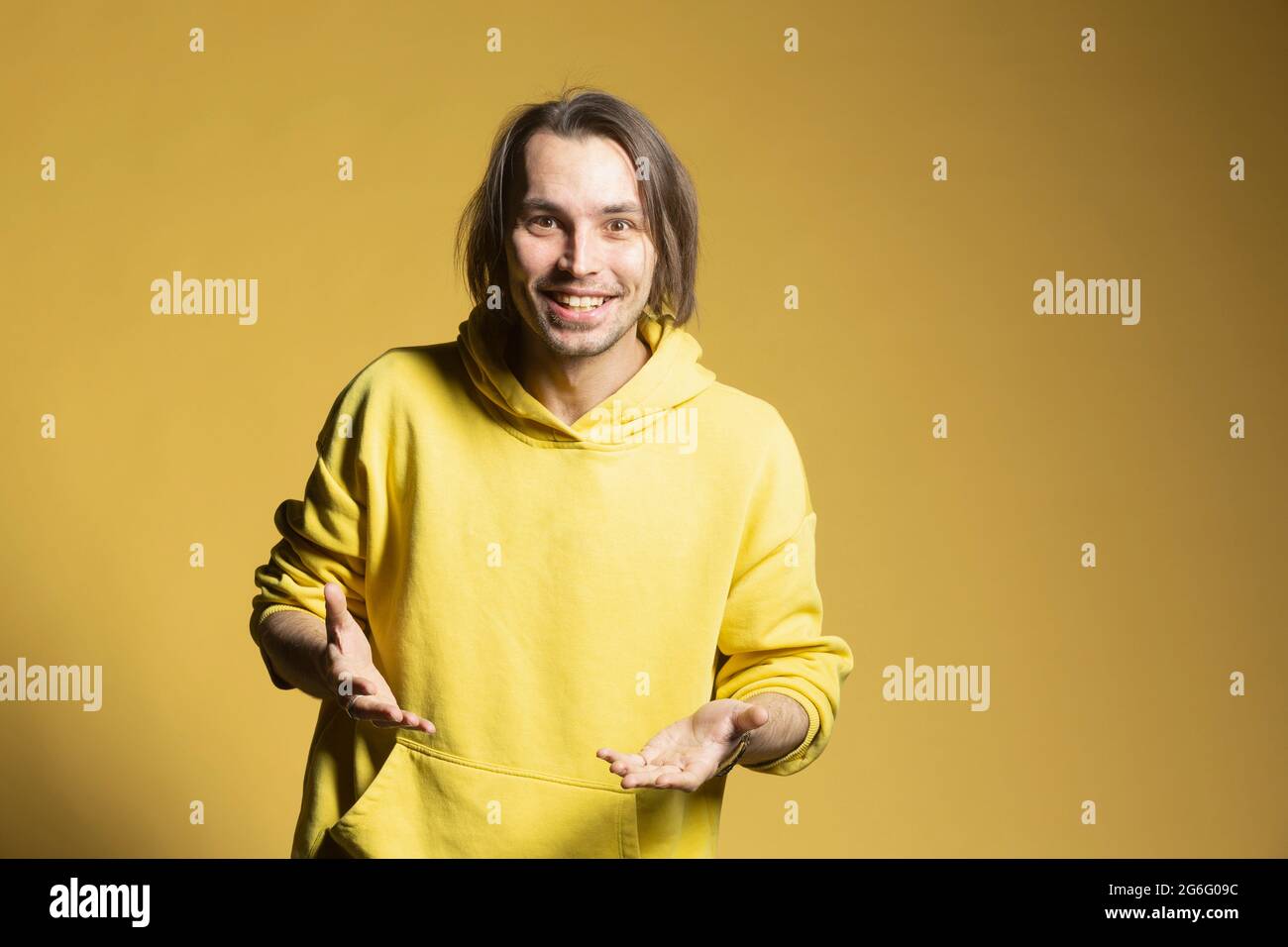 Portrait happy, excited young man on yellow background Stock Photo