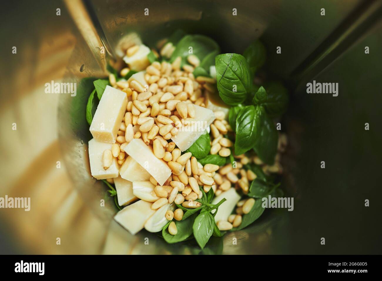 Close up pesto ingredients in blender Stock Photo Alamy
