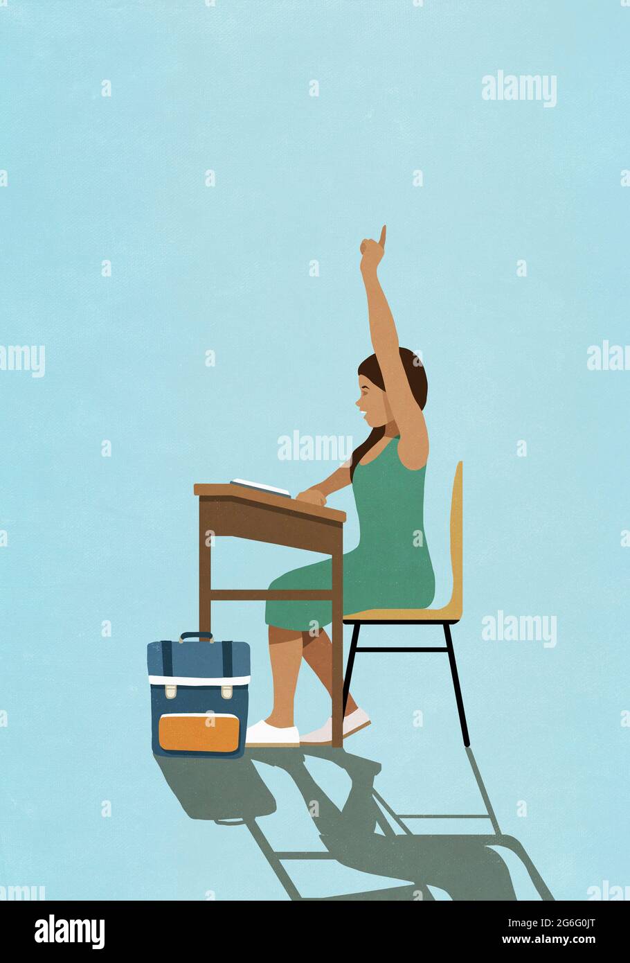 Schoolgirl raising hand at classroom desk Stock Photo - Alamy