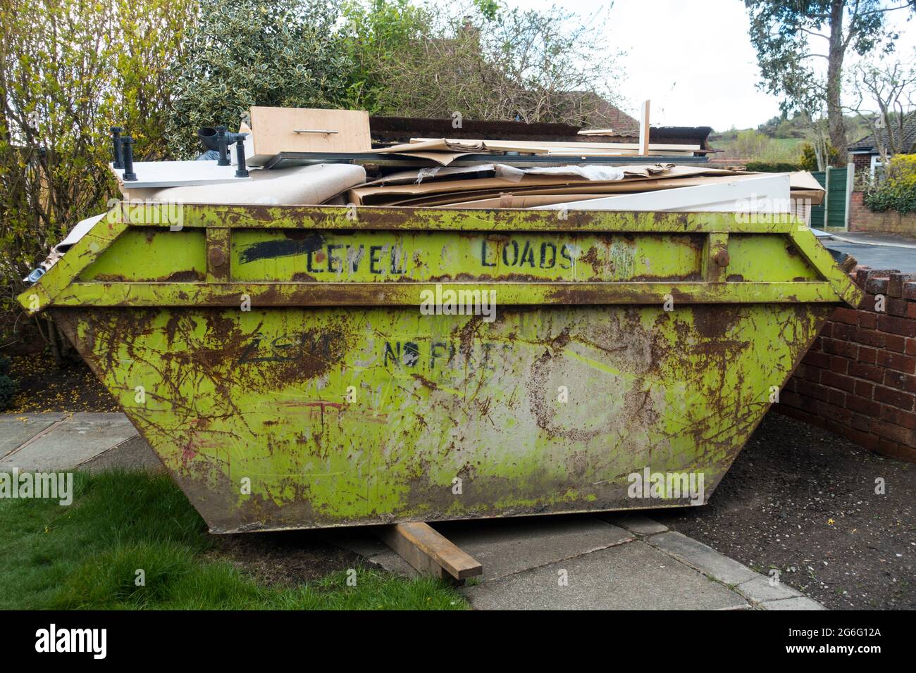 Overloaded Skip, England, UK Stock Photo Alamy