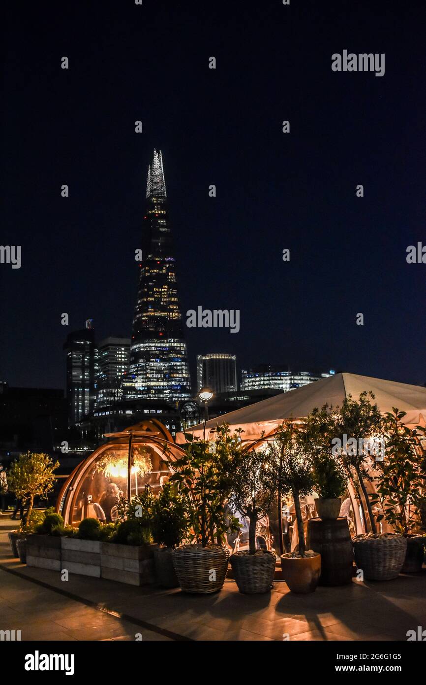 Outdoor dining outside at the Coppa Club, London overlooking the Thames and the Shard. Stock Photo