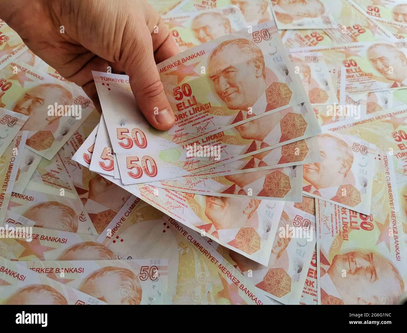 Hand holding Turkish money. Stock Photo