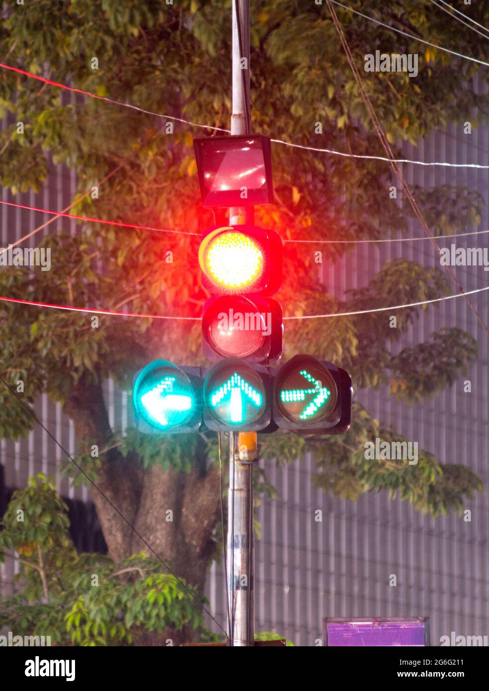 Traffiic signal showing both red and green lights at the same time at a traffic junction Stock