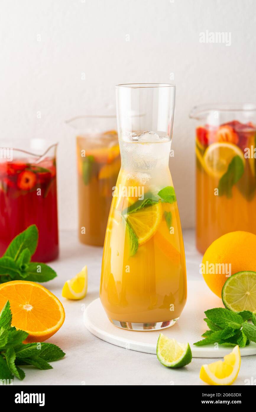 https://c8.alamy.com/comp/2G6G3DX/jugs-of-fresh-refreshing-fruit-drinks-with-fruit-wedges-summer-cold-juices-with-ice-2G6G3DX.jpg