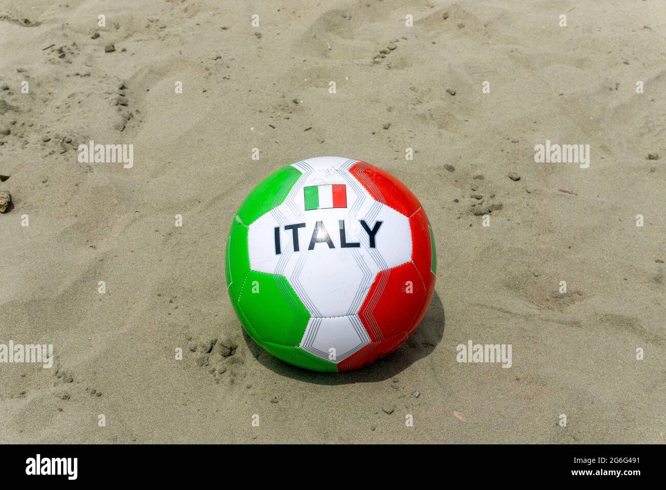 Red, green and white football soccer ball with Italy printed on it on beach Stock Photo Alamy