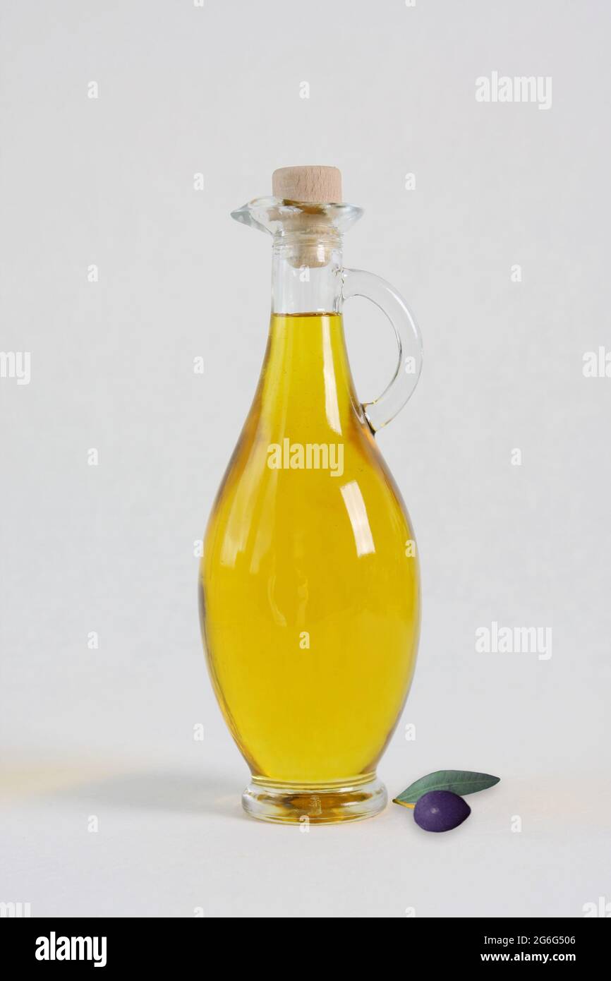 olive tree (Olea europaea), carafe with olive oil and olive Stock Photo