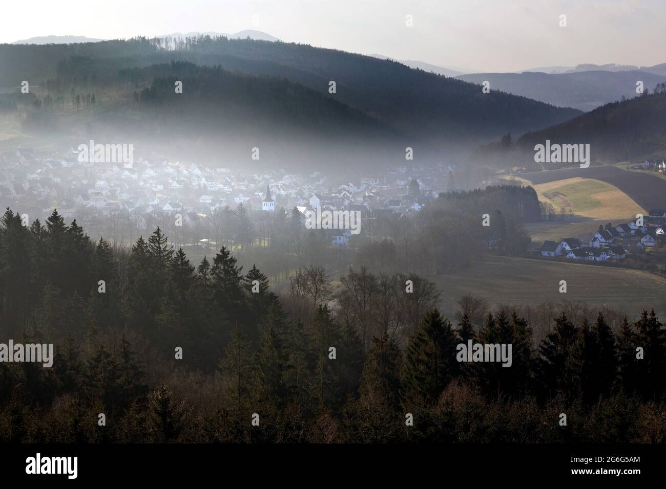 low mountain landscape with a view of Bestwig in the morning mist, Germany, North Rhine-Westphalia, Sauerland, Bestwig Stock Photo