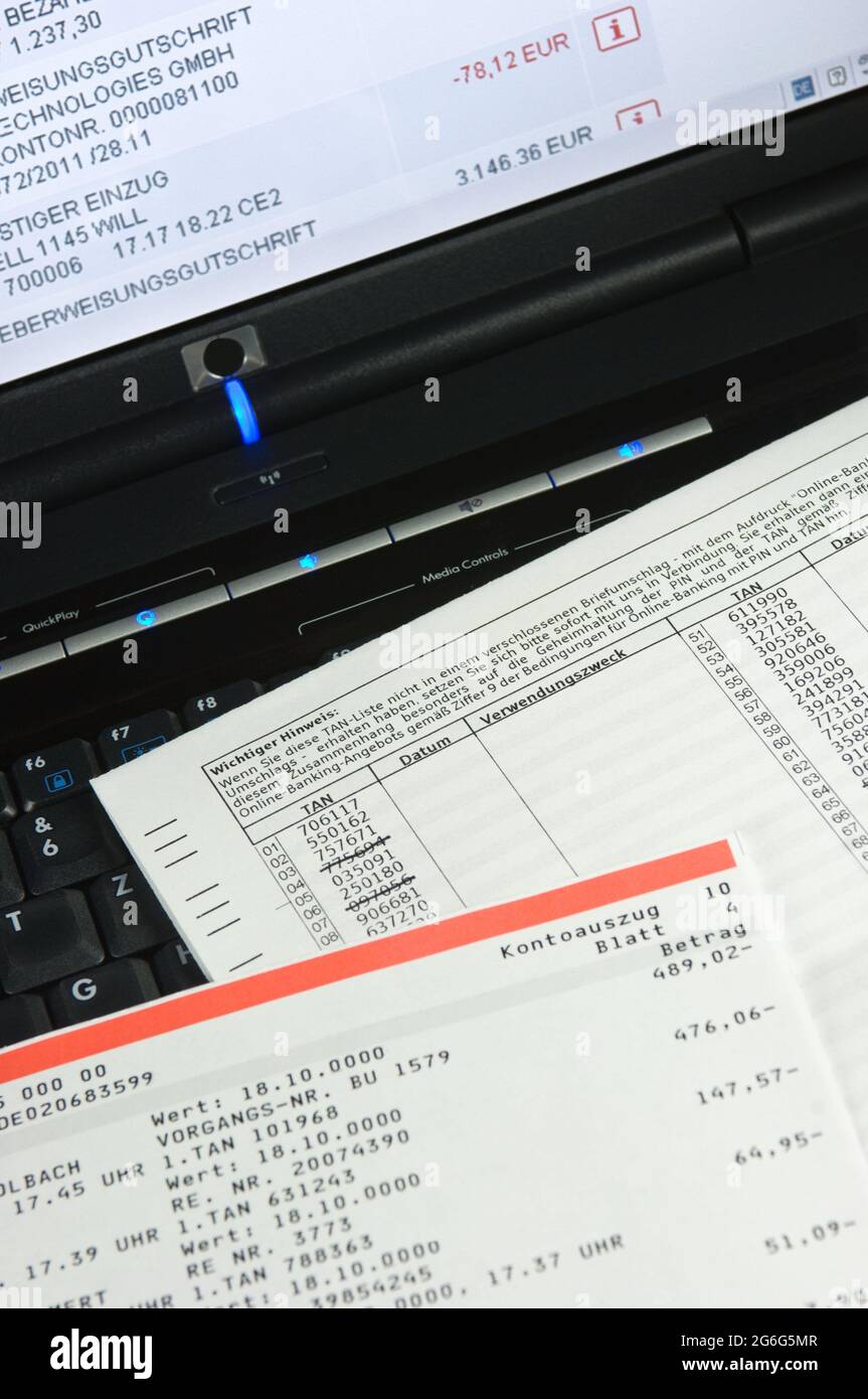 TAN list and account statement on a keyboard, online banking , Germany Stock Photo