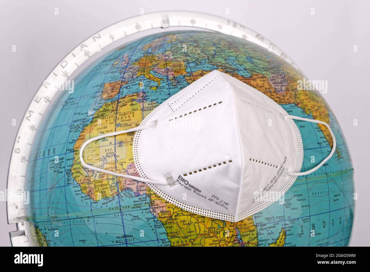 globe with FFP surgical masksm corona pandemie, Bundesrepublik Deutschland Stock Photo
