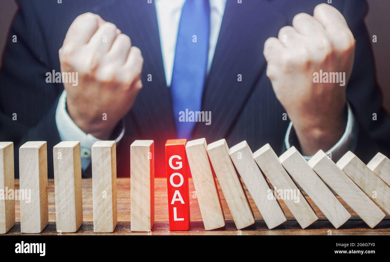 Businessman reached the goal. Completion of the planned task, achievement of the desired result. Planning, risk forecasting. Achieving success. Profes Stock Photo