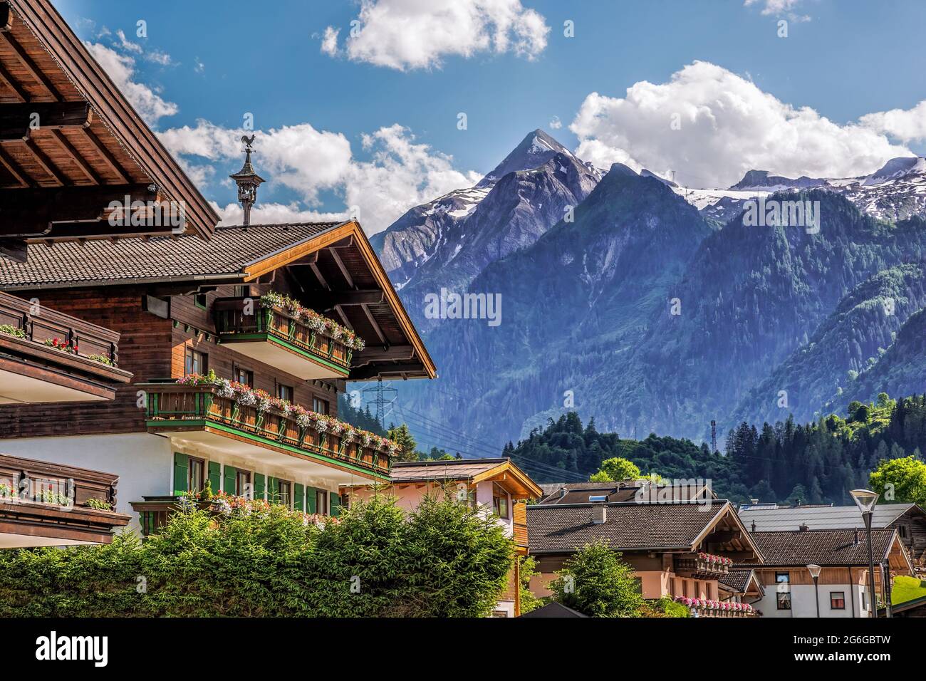 Kaprun village with typical pension against Kitzsteinhorn glacier in Salcburg region, Austrian Alps Stock Photo