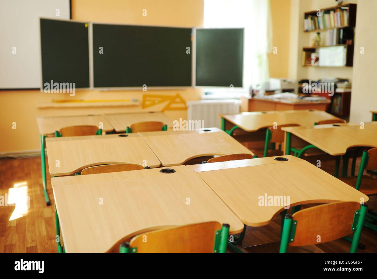 Closeup student chair seat and desk in classroom background with on wooden  floor. Education and Back to school concept. Architecture interior. Social  Stock Photo - Alamy
