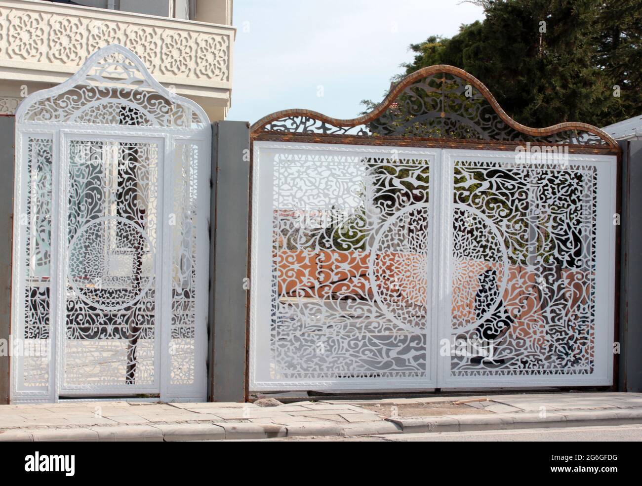 White wrought iron gate of modern villa Stock Photo Alamy