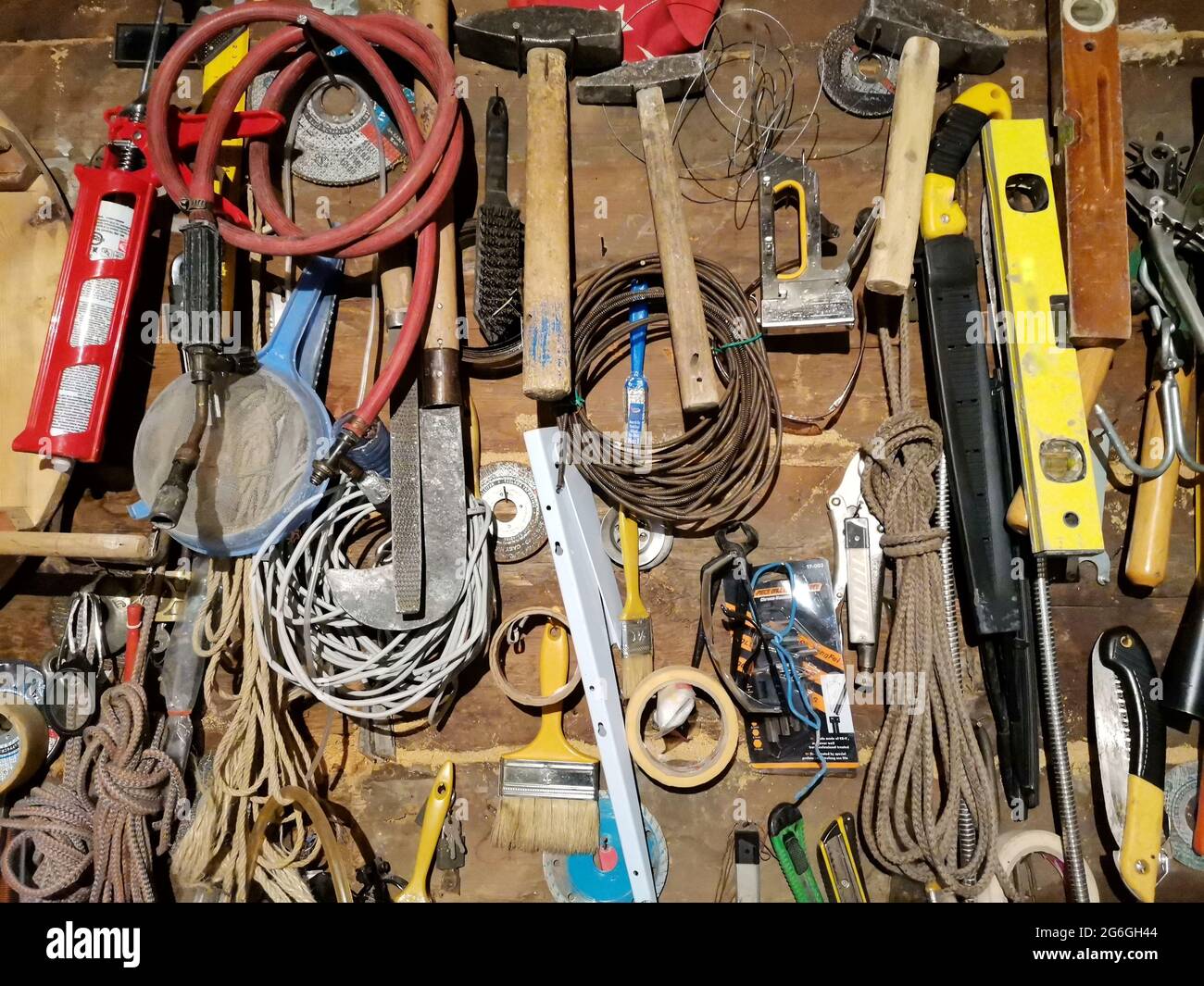 Hardware material. Hardware materials. Hammer, rope, saw. Stock Photo
