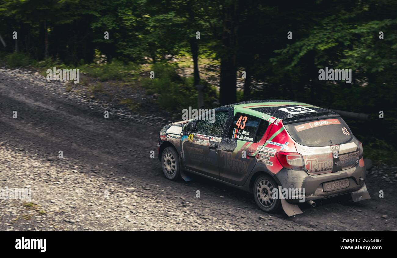 Woops Tracks Rallye Action shot of rally car during a competition on muddy forst tracks ...