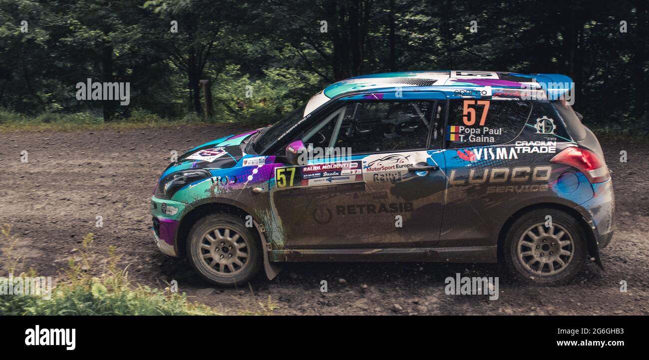 Woops Tracks Rallye Action shot of rally car during a competition on muddy forst tracks ...