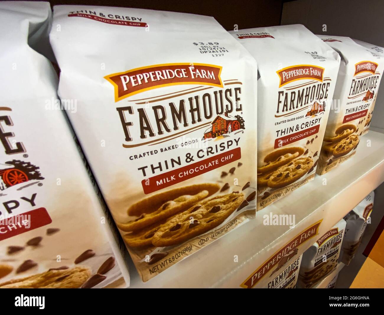 Saint Louis, MO—July 2, 2021; rows of paper bags filled with cookies and other baked goods on shelf of grocery store displaying the brand Pepperidge F Stock Photo