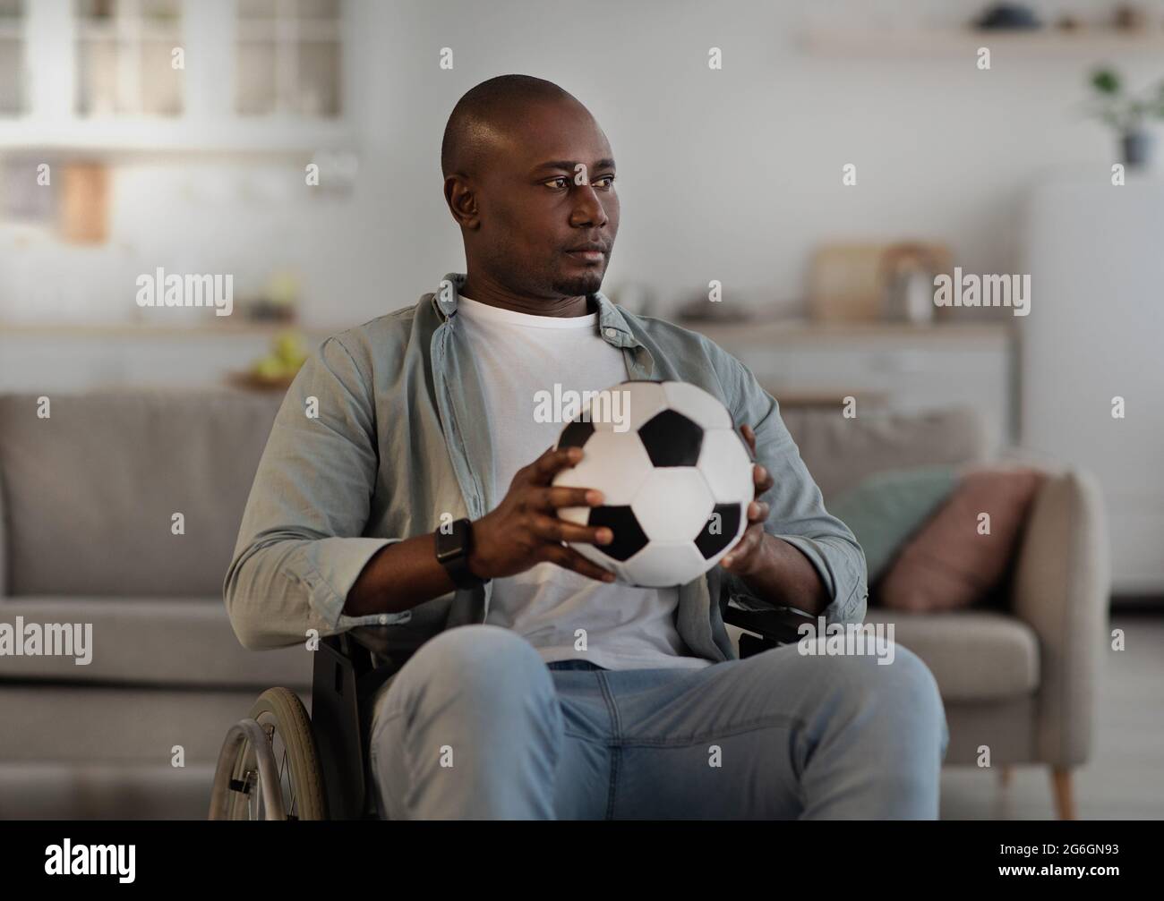 Loss, lonely, expression of sadness, sports injury and recovery at home Stock Photo
